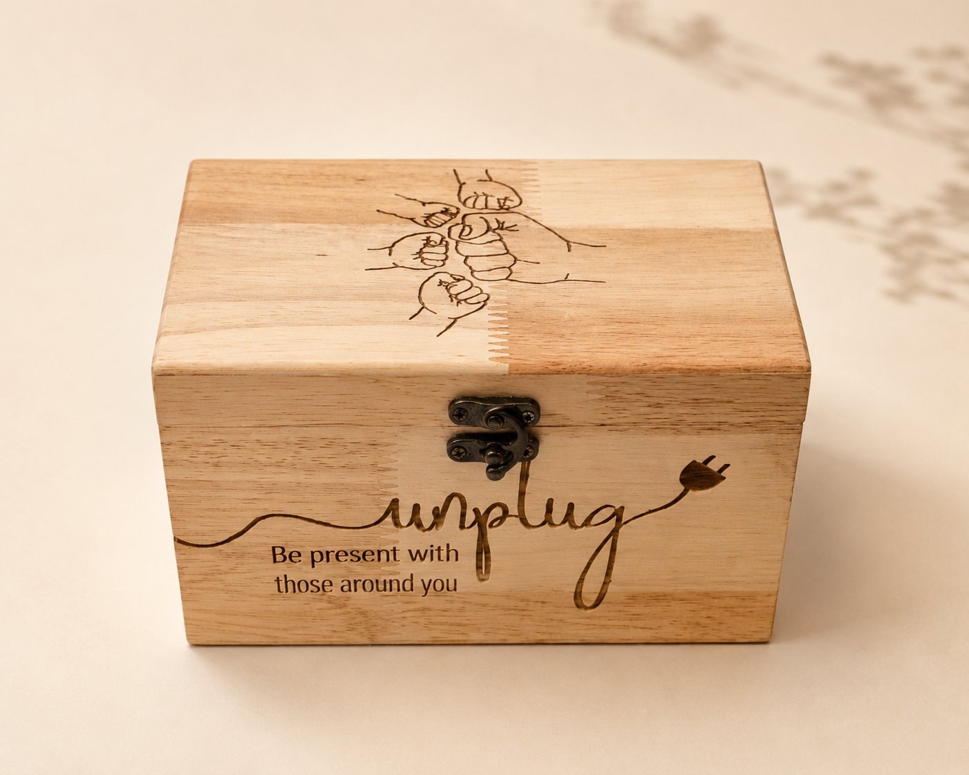 Unplug — a wooden box asking you to be present with those around you