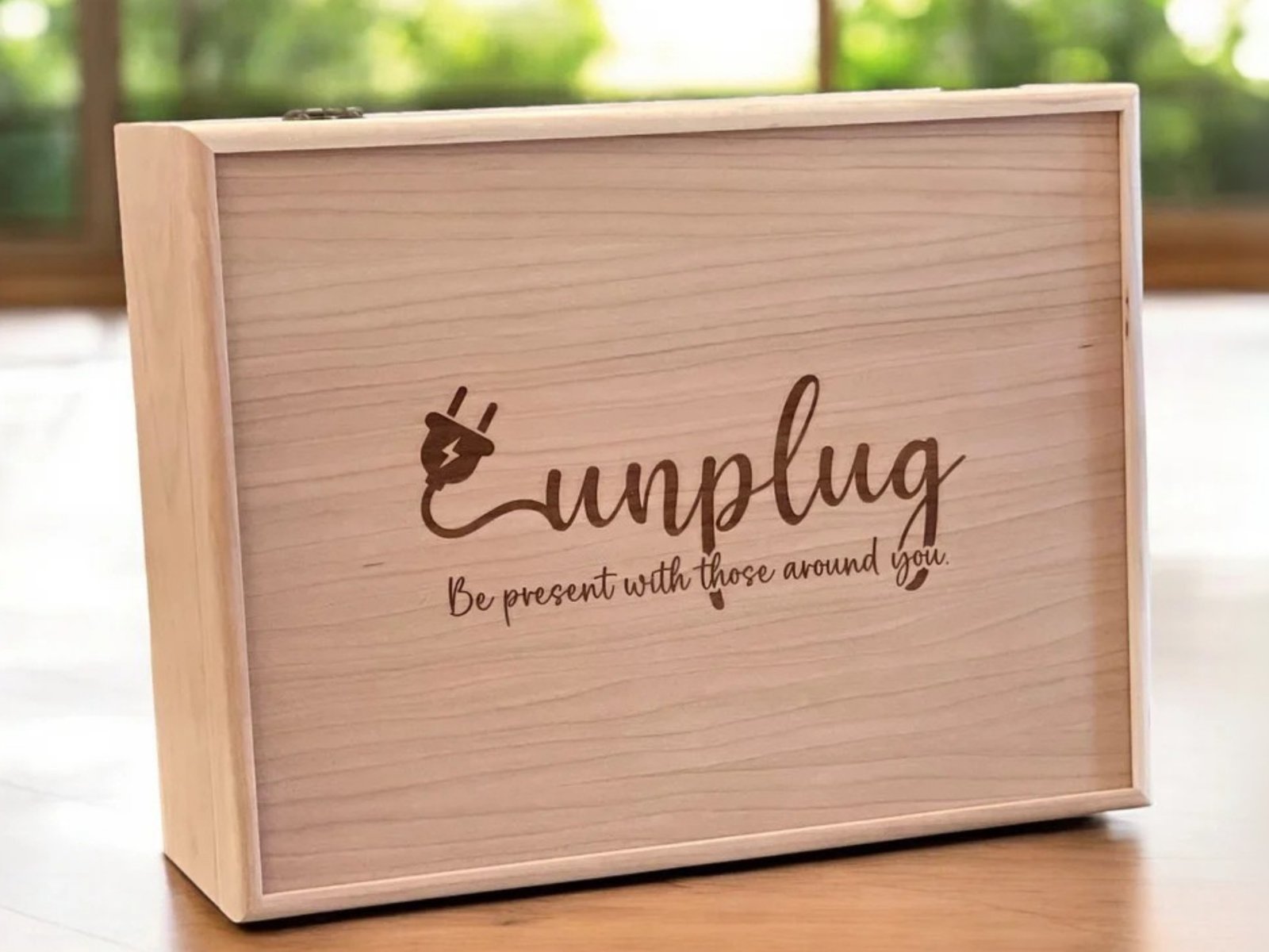 Unplug — a wooden box asking you to be present with those around you